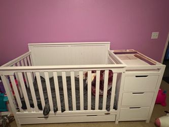 Baby crib with changing station and storage