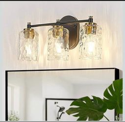 3-Light Black and Gold Vanity Light with Hammered Glass Shades