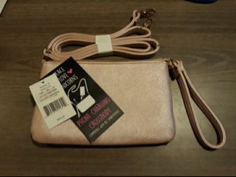 Pink wristlet with phone charger