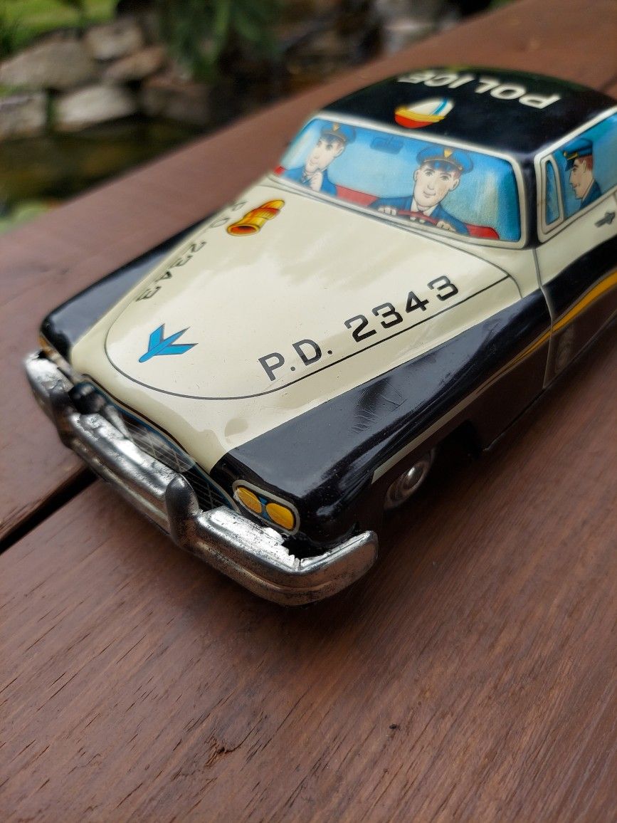 Vintage metal friction patrol car