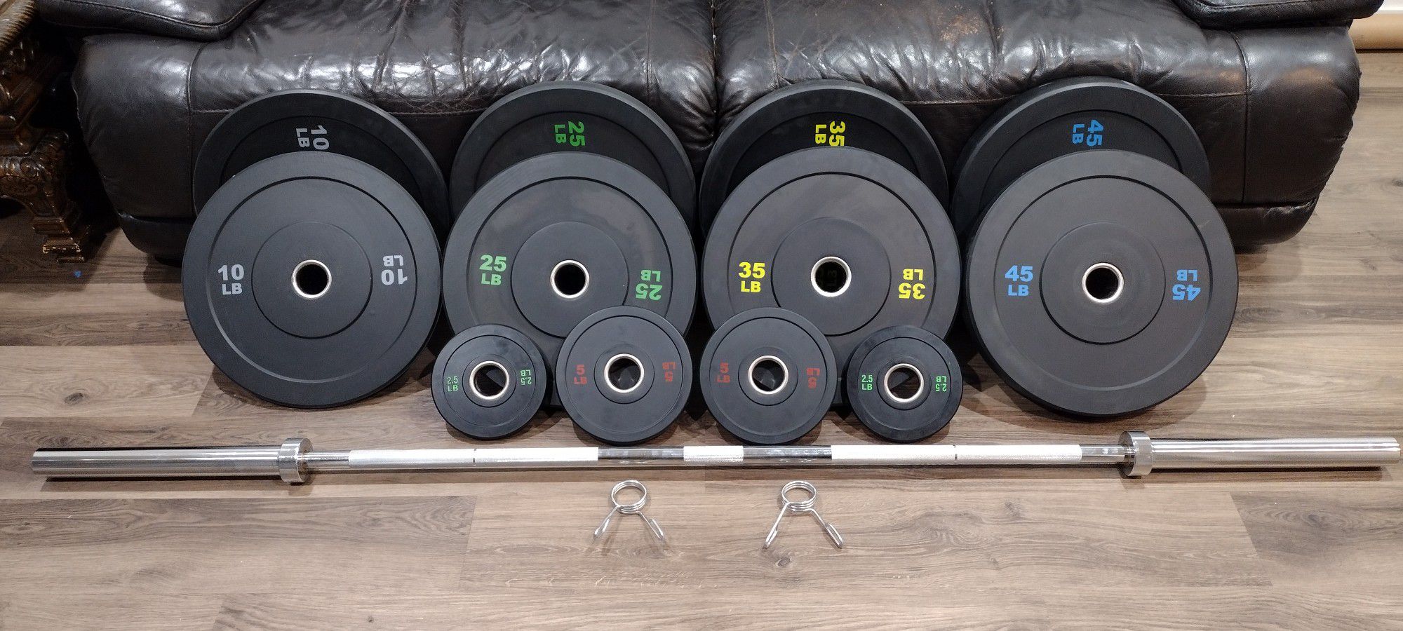 OLYMPIC  BARBELL BAR  7ft.
 45lb. AND OLYMPIC BUMPER
  WEIGHT  PLATES.
