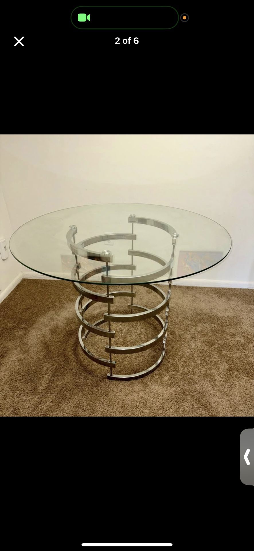 Arkesha Round Glass Top Metal Base Dining Table from Wayfair