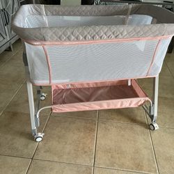 Pink And grey Baby bassinet