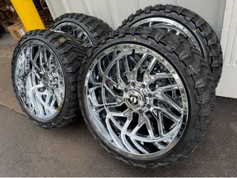NEW 24x12 chrome TIS wheels wrapped in atturo mts 33x13.50R24 tires.