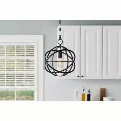 Light fixture with caged orb