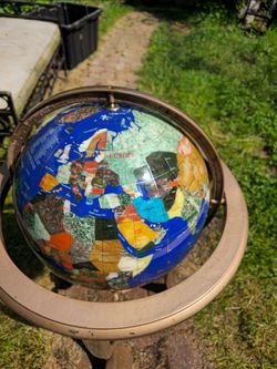 Hard to find globe with natural stones.