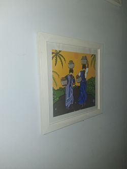 Indian women walking g with baskets framed art