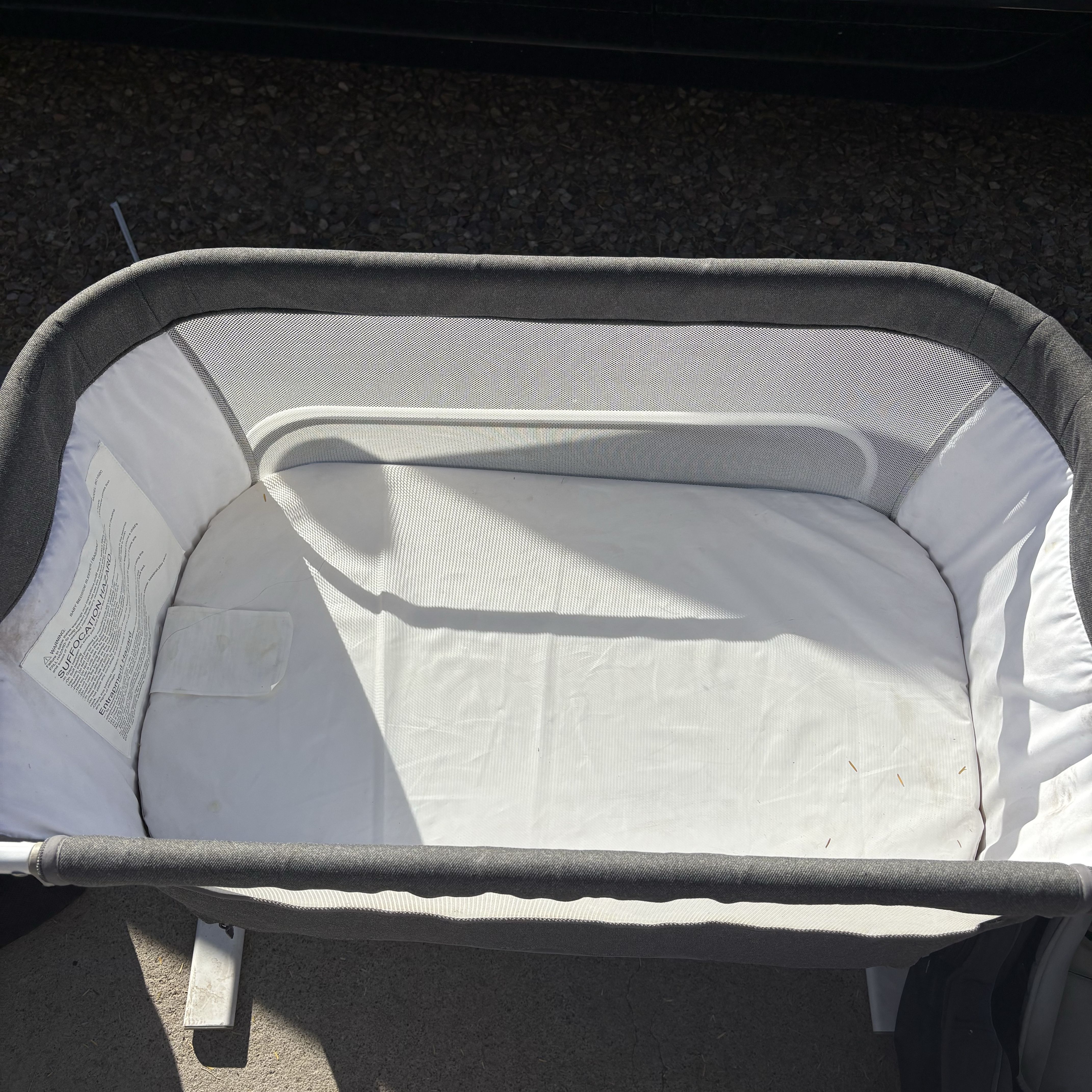 Gray and White Portable Bassinet