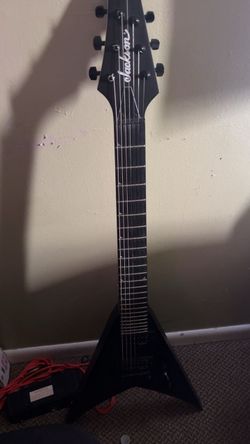 Jackson 7 string used in fair condition with sum knicks