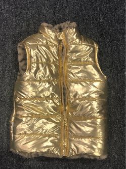 Girls reversible faux fur/ metallic puffer vest in size 6
