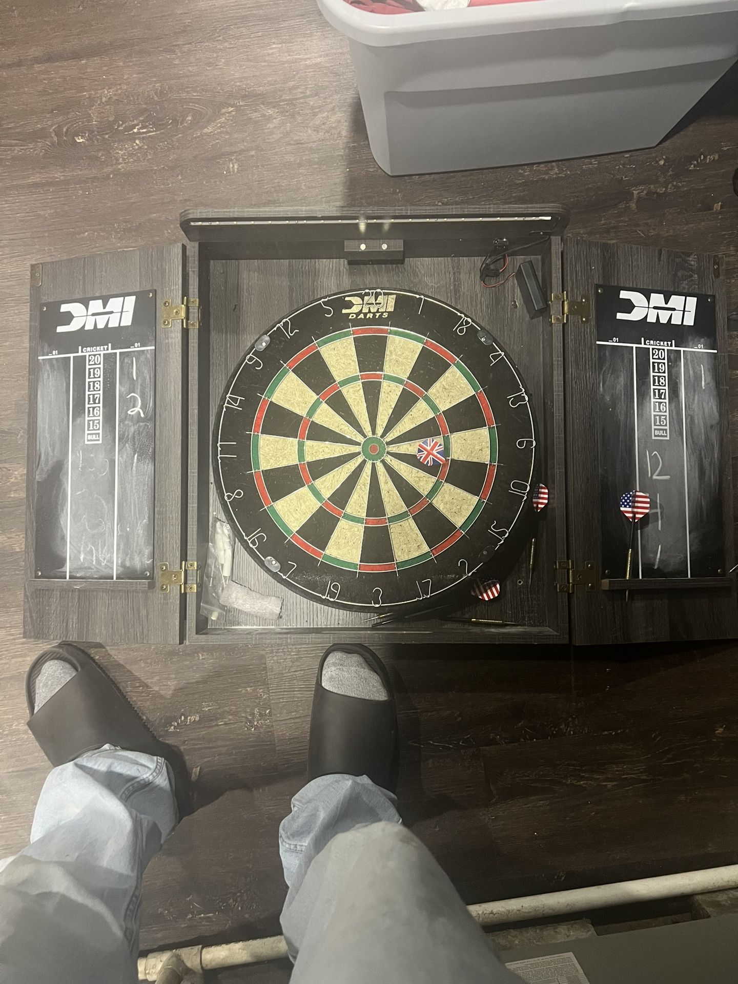 dart board with new darts 