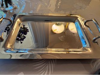A set of two stunning, brand new stainless steel trays,  perfect for serving, durable, and rust-resistant.