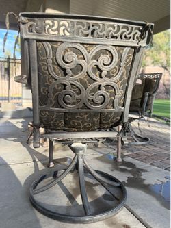 Premium cast iron 4 swivel rockers with a large mosaic iron table! Very sturdy!