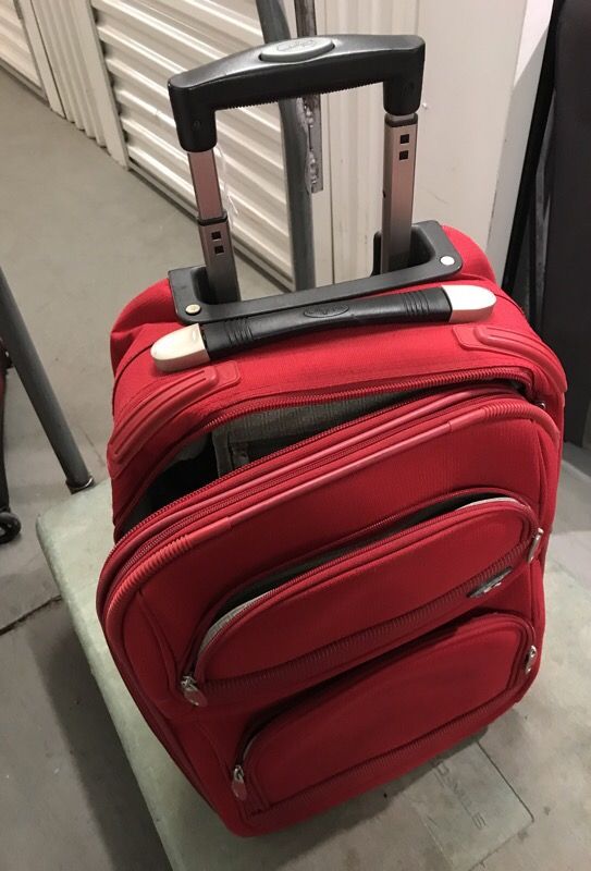 Small carry-on Red Olympia luggage (used, but all zippers, handles and wheels working)