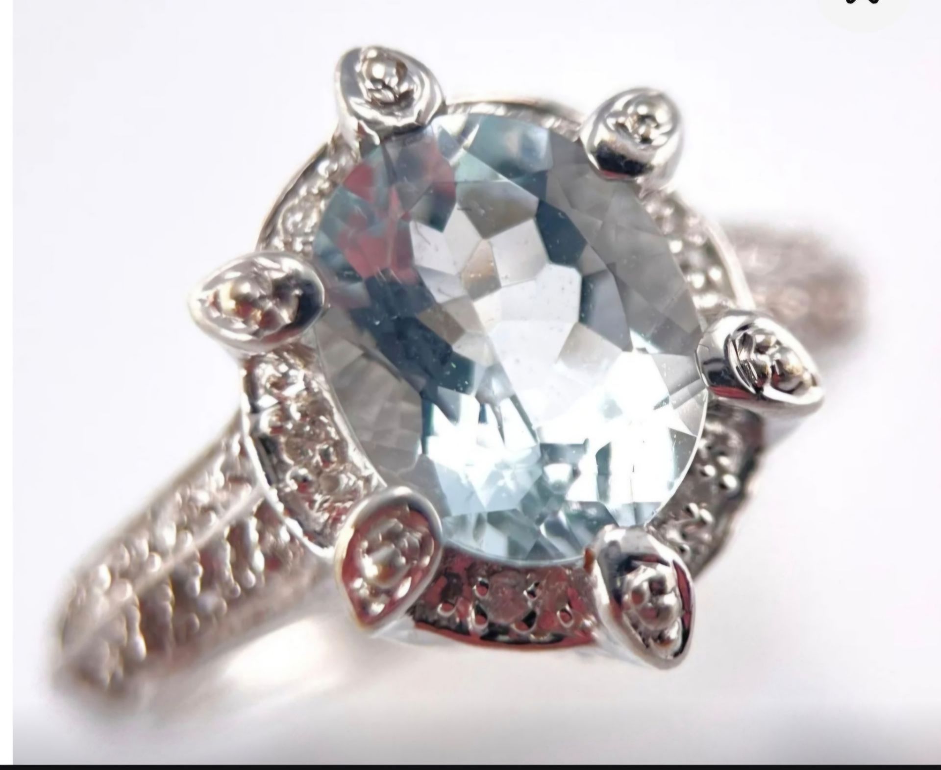 14k White Gold
with 1.33ct Aquamarine and aprox .47ct in Diamonds,
Ring size 9
