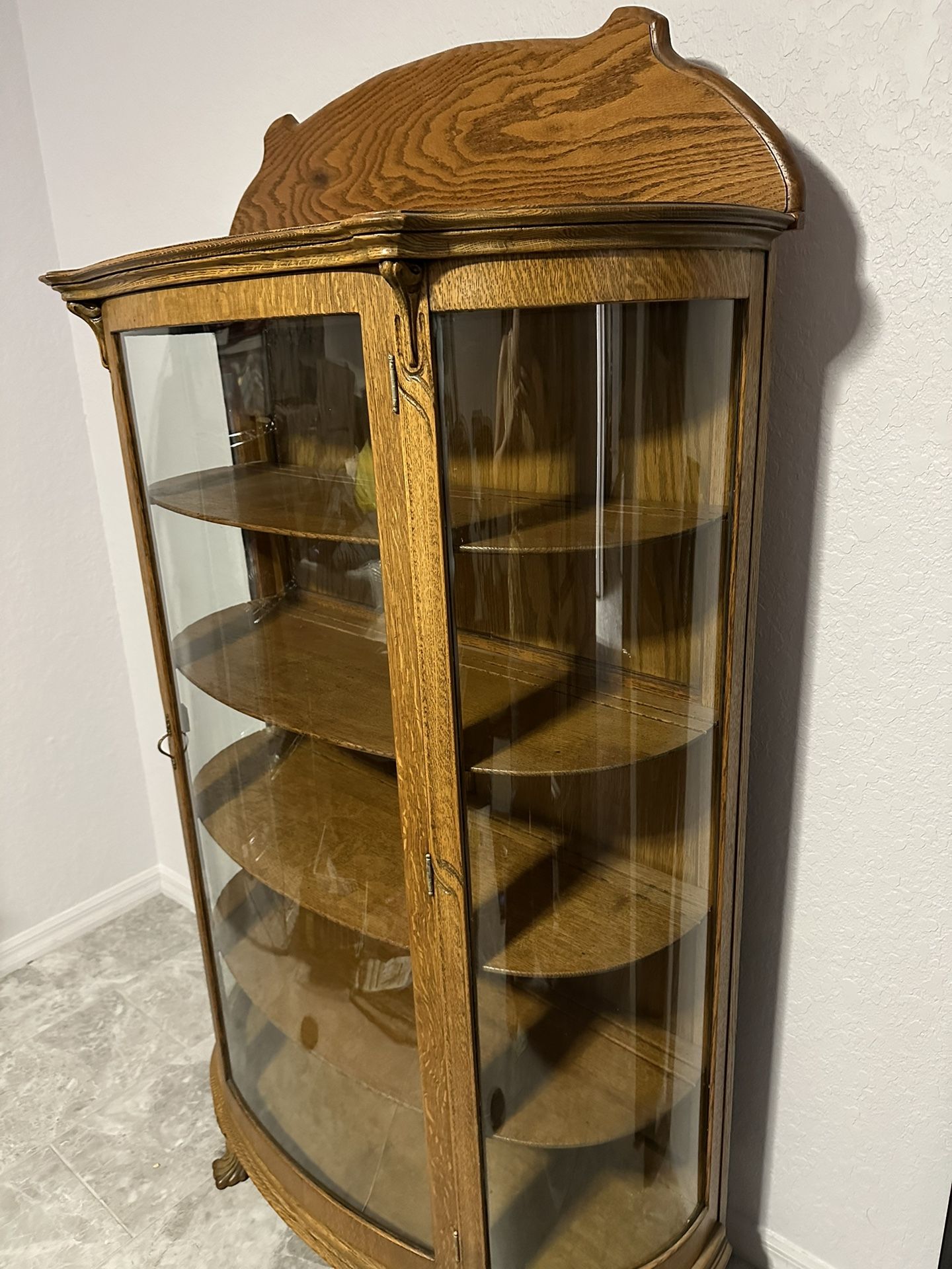 Antique curved glass cabinet