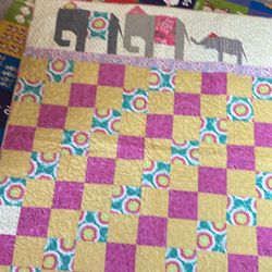 Quilt 42x53 hand sewn  multitude of colors and patterns  elephant trio at top 
