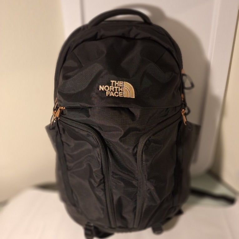north face black and gold backpack The Women's Borialis  Saint Bernard it has since become a classic on campus and on the job Northface Surge Rose Gold/Black Backpack