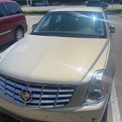 08 Cadillac, DTS. Champagne Gold  Sedan With black wrap