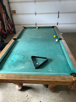 Pool table with light, sticks and stick rack