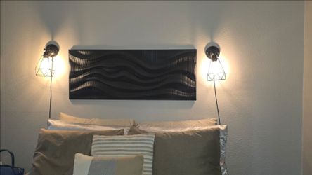 Over bed wsll art with lamps