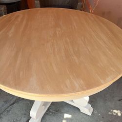 Wood round dining table .