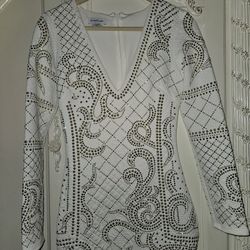 This beautiful bebe brand dress in white embroidered with gold stones is perfect for these holidays. Like New!