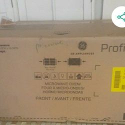 BRAND NEW GE MICROWAVE OVEN