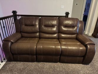 1 Power Recliner Couch, 1 coffee table and 2 end tables.