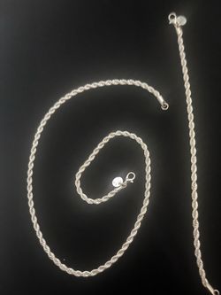 Polished 925 Sterling Silver Overlay curb link chain necklace. This piece has a lobster claw clasp and a flat link design.