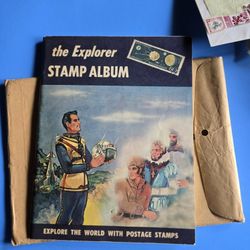 Early 1960's EXPLORER STAMP ALBUM W/ MANY STAMPS 