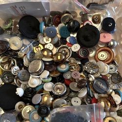 Buttons galore, a box of vintage buttons