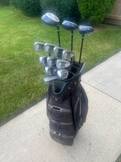 LIKE NEW complete set of men’s RH Wilson Power Chamber golf clubs in a Datrek cart bag.
