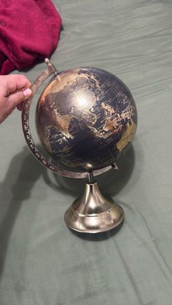 Gold and black world globe