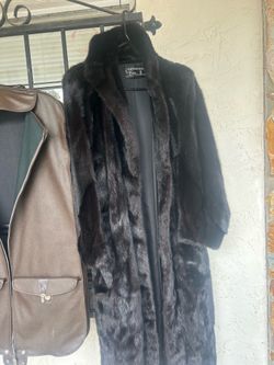 Fur coat and leather bag
