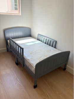 Bed with bedrails and mattress