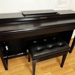 Yamaha Piano and A Baby Grand Piano