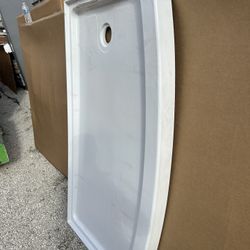 Hi every one we this shower base on sale retail is $329 wt tax  we have this base for  only $125 have one cut on top right side you can just glue it t