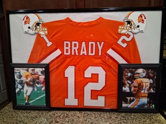TOM BRADY OF THE TAMPA BAY BUCCANEERS CUSTOM STITCHED, CREAMSICLE FRAMED JERSEY.