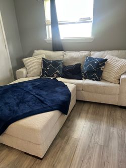 Sofa with ottoman and round swivel chair