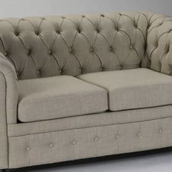 Chesterfield style loveseat in cream linen