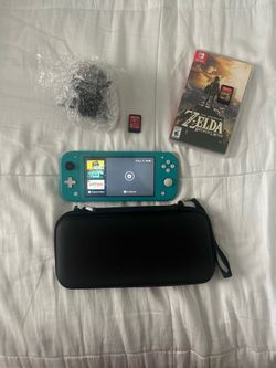 Nintendo switch lite blue w/ Mario odyssey & zelda : breath of the wild