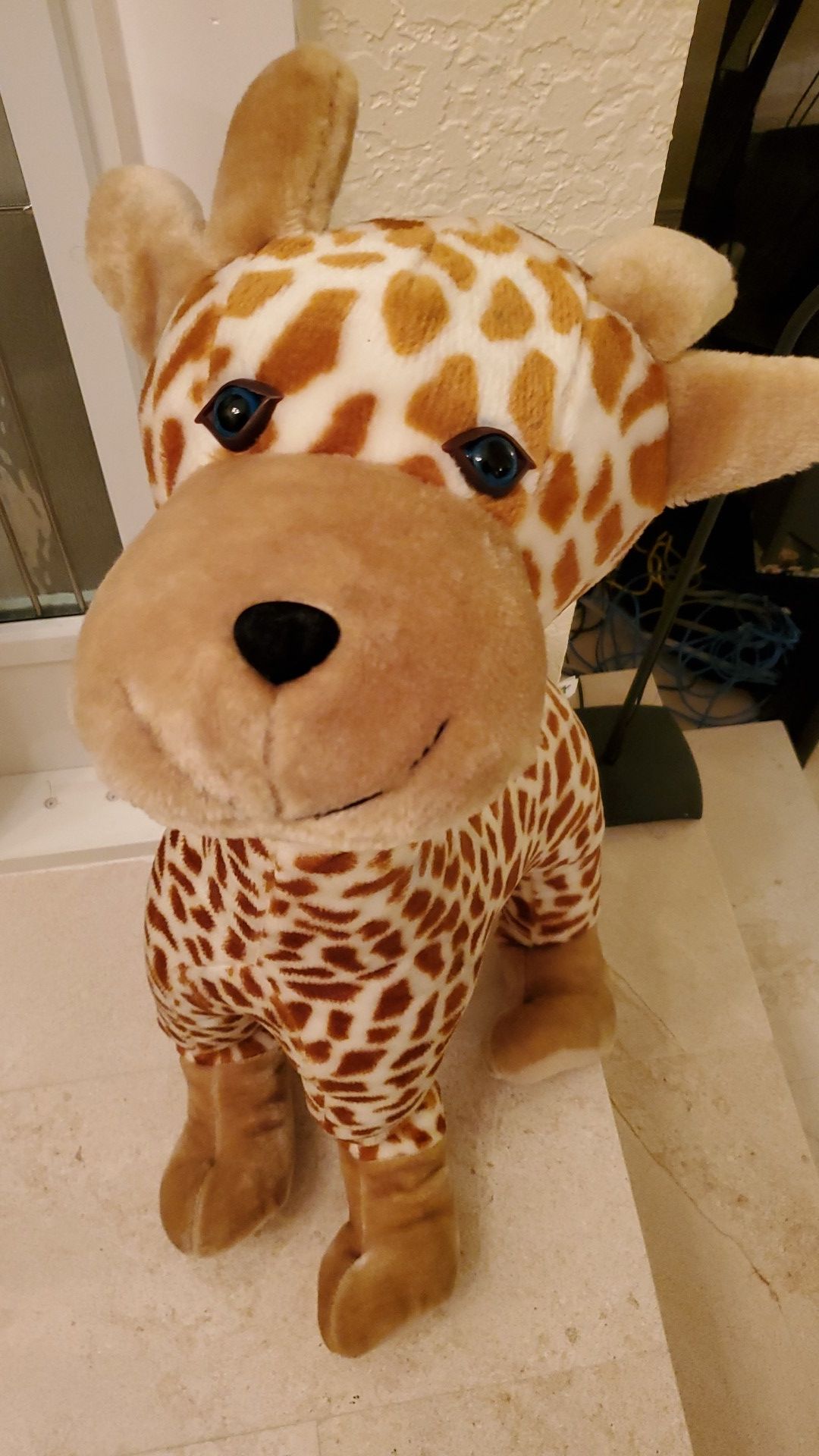 Giant giraffe stuffed animal and inflatable plush