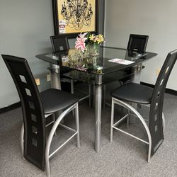 Brand New Glass Pub Table With 4 Black Chairs