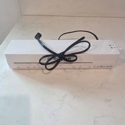 $12 Laminator = NEW. + Laminator sheets