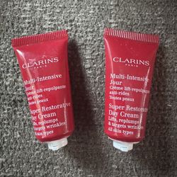 2- Clarins Super restorative day cream .1oz 5ml