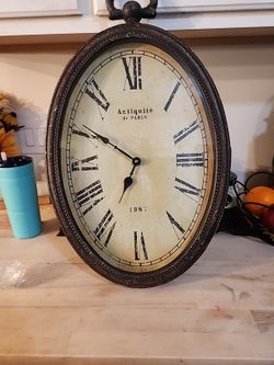 "Antiquité de Paris" oval wall clock
