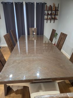 Contemporary designer dining table with 8 chairs and matching Curio