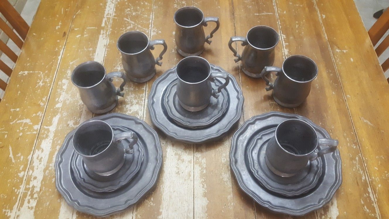 Midevil Crown castle LTD eight-piece pewter dish set.