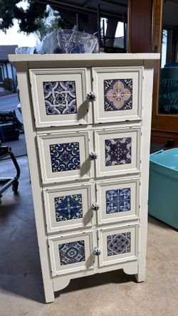White Wood Cabinet with Decorative Tile Panels